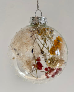 Glass Christmas decorations with dried flowers